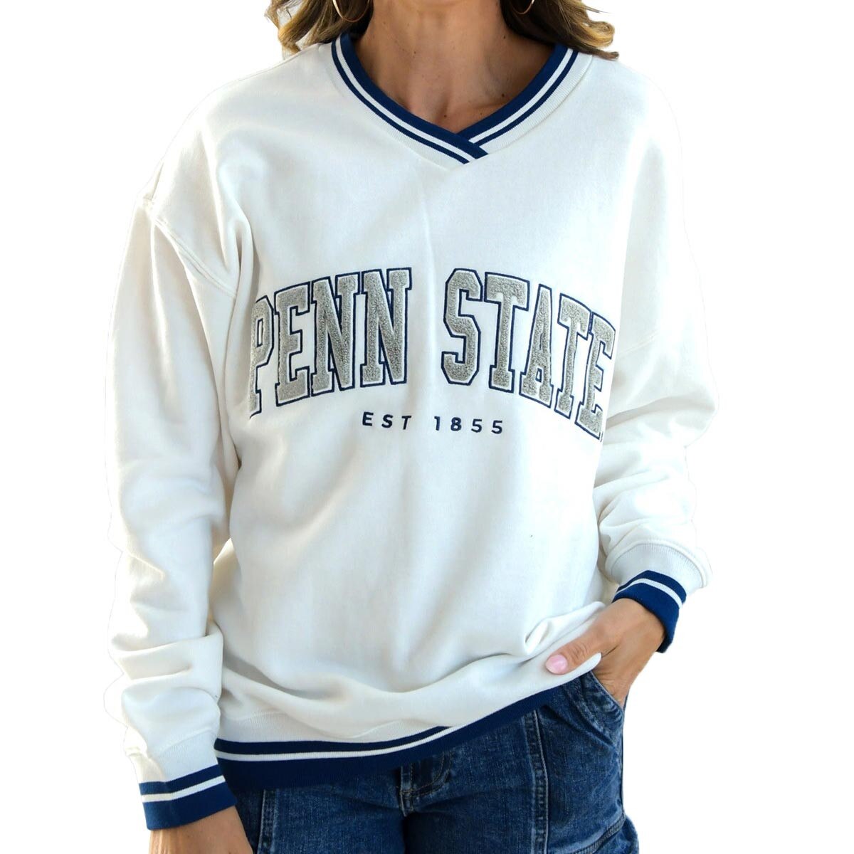 model wearing white v-neck sweatshirt with Penn State Est 1855